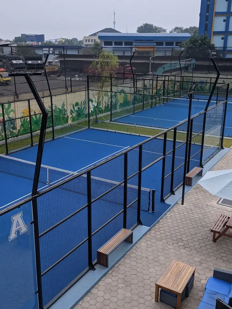 Blue padel court A with glass walls